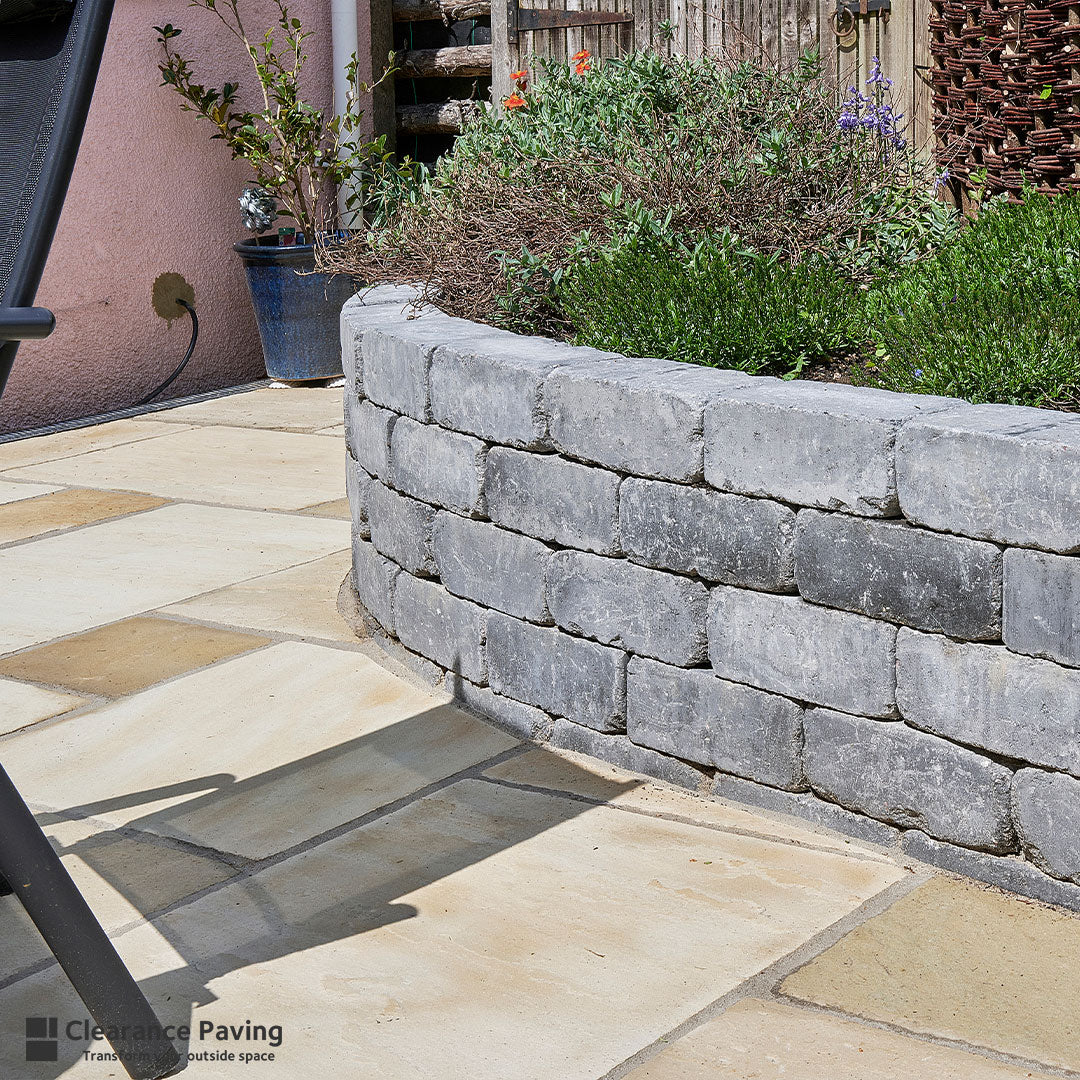 Indian Sandstone garden paving in Fossil Mint with a Vintage Kerb wall