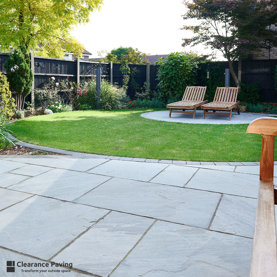 Indian Sandstone multi sized paving slabs in Mountain Mist with lawned area