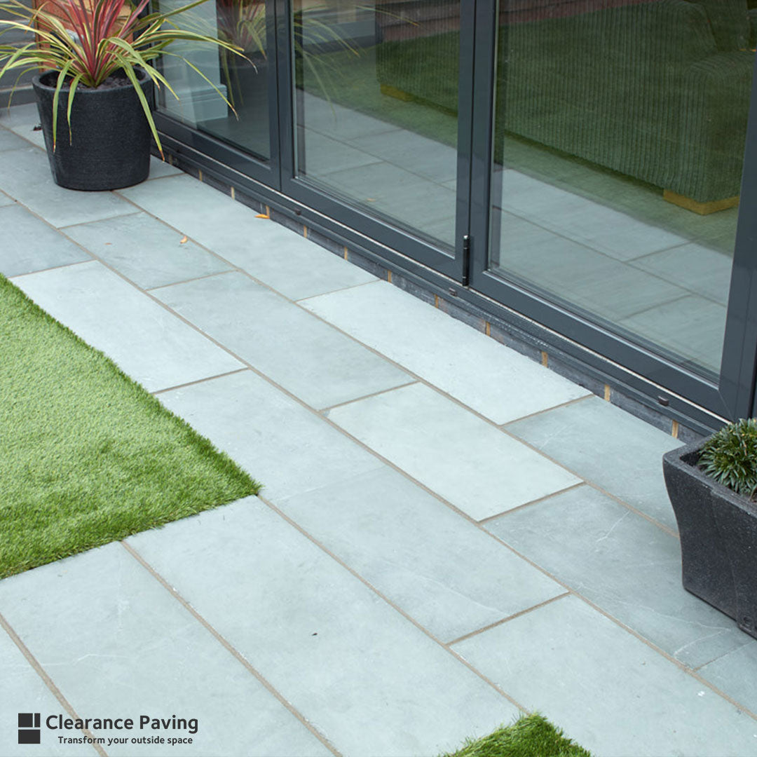 Brett Brazilain Slate paving slabs in a linear pack and Woodland Grey colour