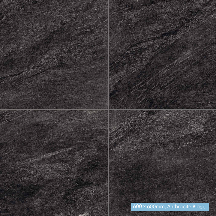 Four dark stone-look square tiles arranged in a 2x2 grid, showing a textured anthracite black surface with subtle gray veining. A small label in the bottom-right corner reads '600 x 600mm, Anthracite Black'.