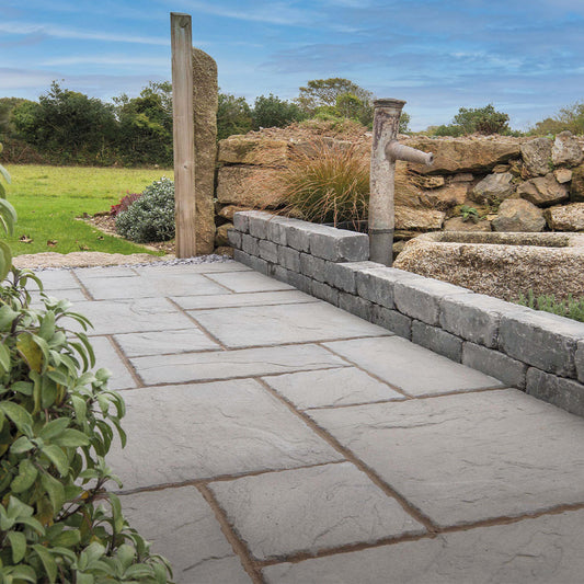 Brett Canterbury garden slabs in slate grey rustic patio slabs